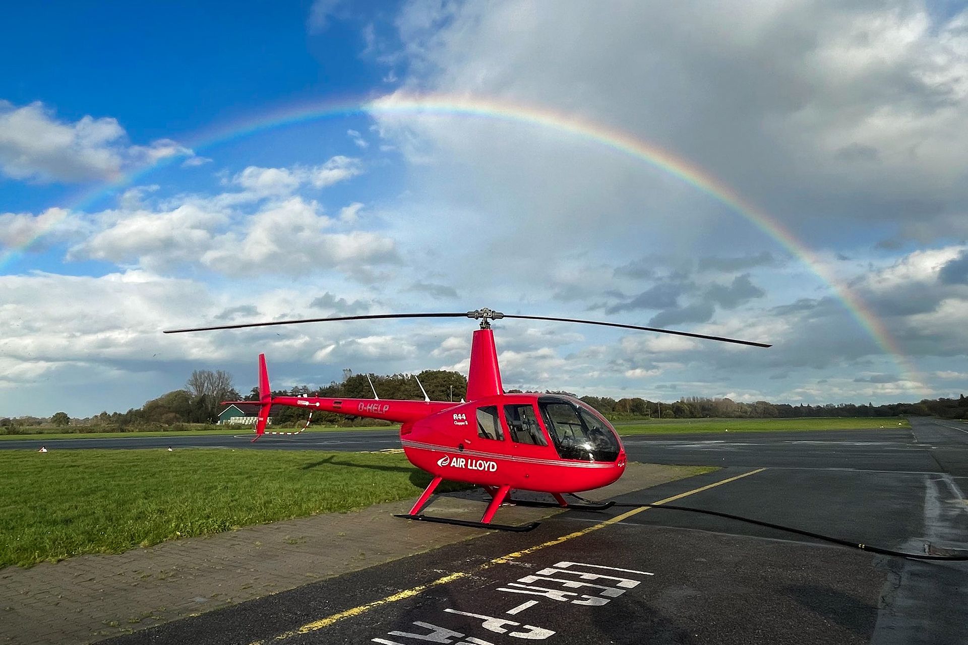 AIR LLOYD Flight Service - R44 helicopter under rainbow